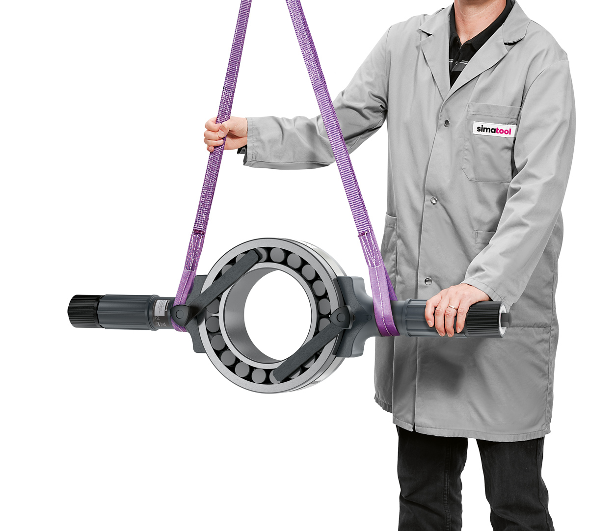 Le simatool BHT 200-400 entoure la bague extérieure du roulement à rouleaux sphériques d'une bande d'acier.  L'alésage reste libre, de sorte que le roulement peut simplement être poussé sur un arbre. 